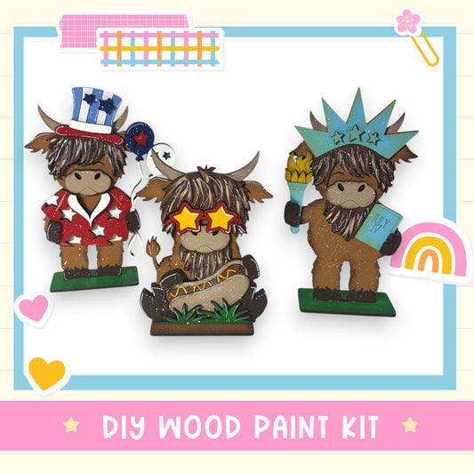 three wooden figurines dressed in patriotic outfits, including hats and patriotic colors, arranged in a row.