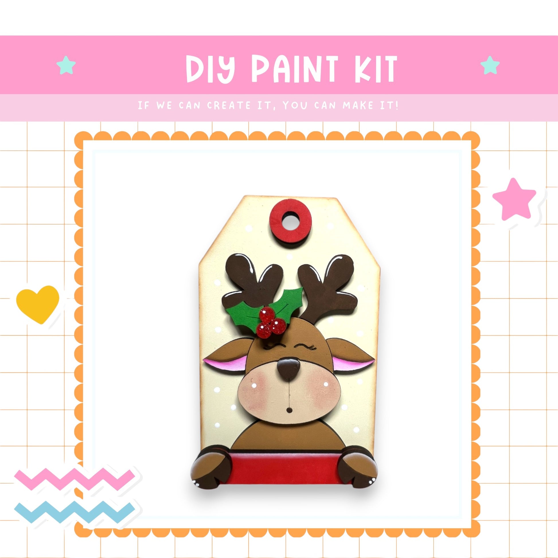 a DIY paint kit with a cute reindeer-like character on a tag. The kit appears to be a creative project that allows users to customize their own tag with a personalized design.