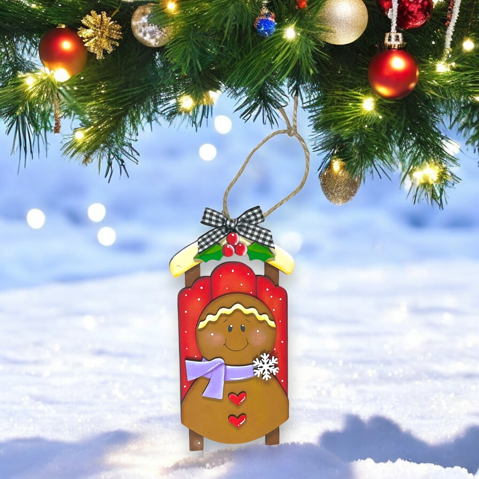 a christmas ornament hanging from a christmas tree