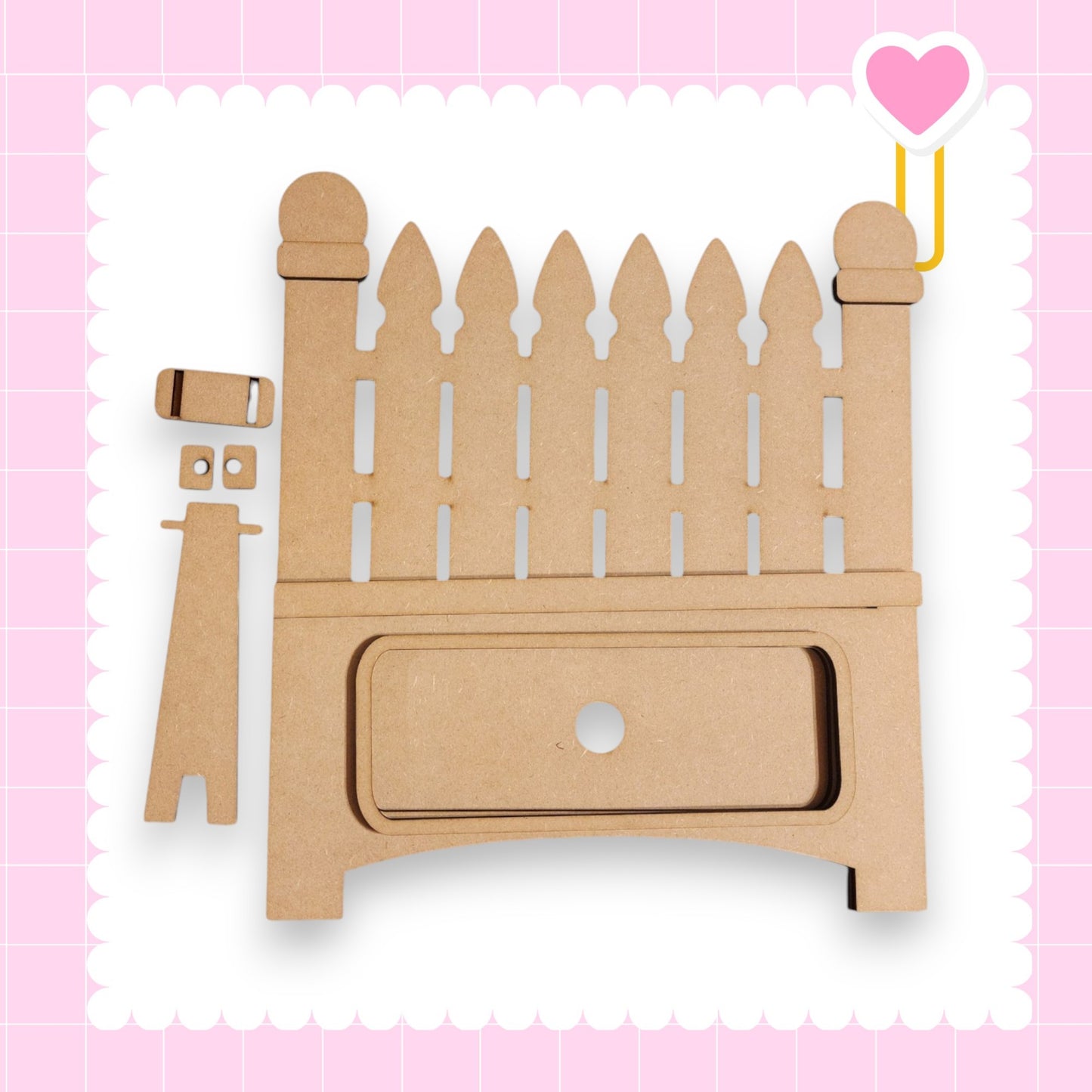 a wooden toy with a fence and a heart