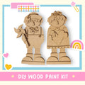 a wooden cutout of two people holding hands
