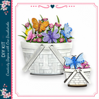 a white basket filled with colorful flowers and butterflies, with a smaller basket containing more flowers and butterflies.