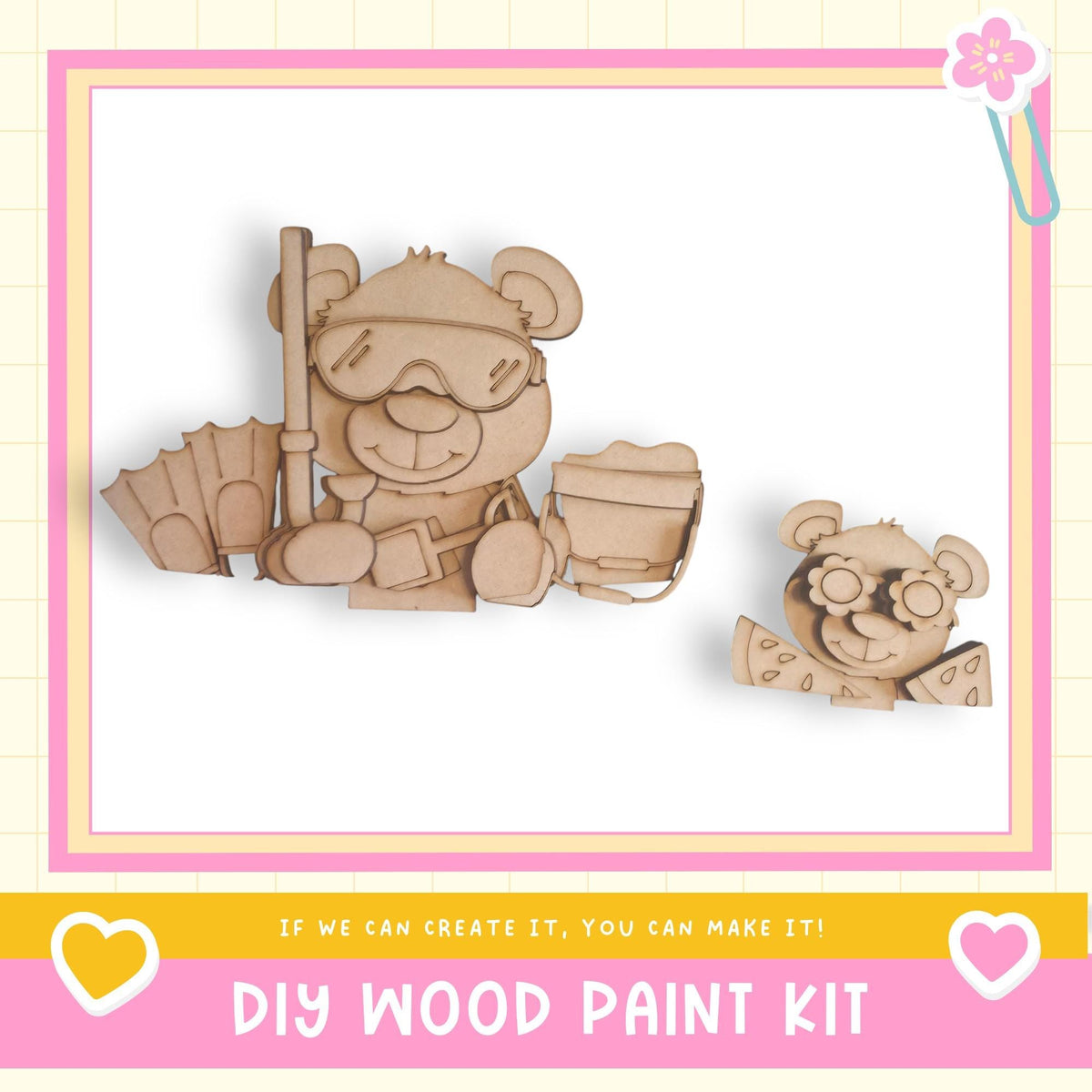 two wooden toy bears, one larger and one smaller, sitting together and smiling. The image is framed with a pink border and includes text that reads "DIY WOOD PAINT KIT" and "If we can create it, you can make it!"