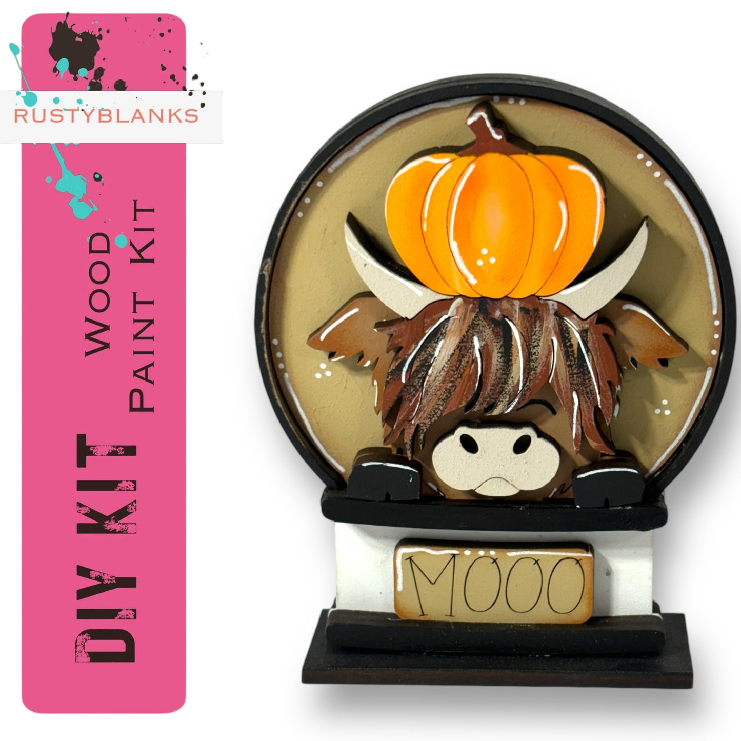 a wooden paint kit with a painted cow and a carved pumpkin on top, along with a sign that says "MOO".