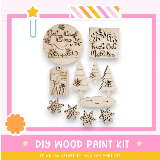 a wooden craft kit with christmas trees and snowflakes