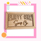 a wooden sign with the words sorry cow soap on it
