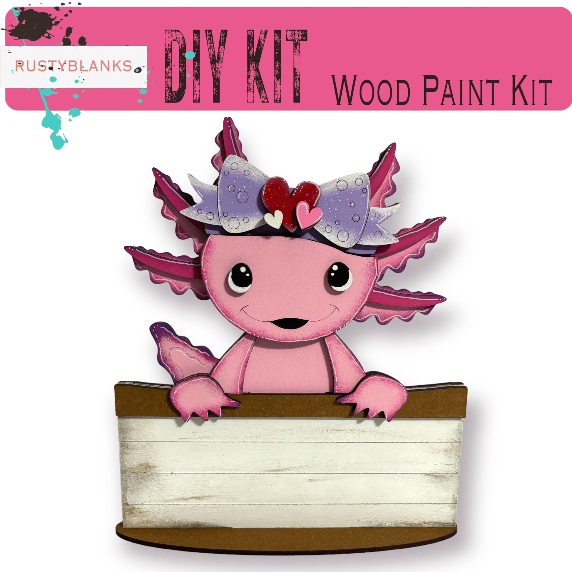 a paper craft kit with a pink dragon sitting on top of a box