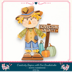 A scarecrow figure holding a sign that says "SCARECROW ON DUTY" and two pumpkins, representing a fall-themed decoration.