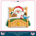 A wooden bed with a Santa Claus figure and a gingerbread man, along with a bird, is depicted in the image.