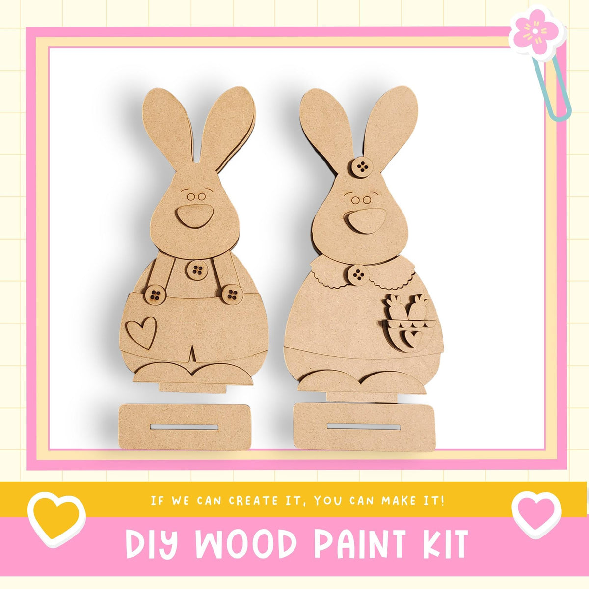 two wooden rabbit figures, each with a heart and a bow, standing on a wooden base. The text below the image reads "DIY WOOD PAINT KIT" and "If we can create it, you can make it!"