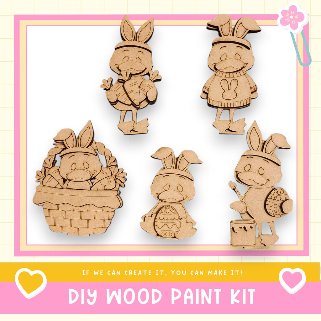 The image is a DIY wood paint kit featuring five wooden Easter bunny characters in various poses, including one in a basket, one holding an egg, and one holding a paintbrush.