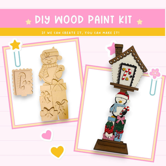 a wooden craft kit with a snowman and a house