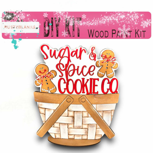 a wooden cutout of a basket of sugar and spice cookies