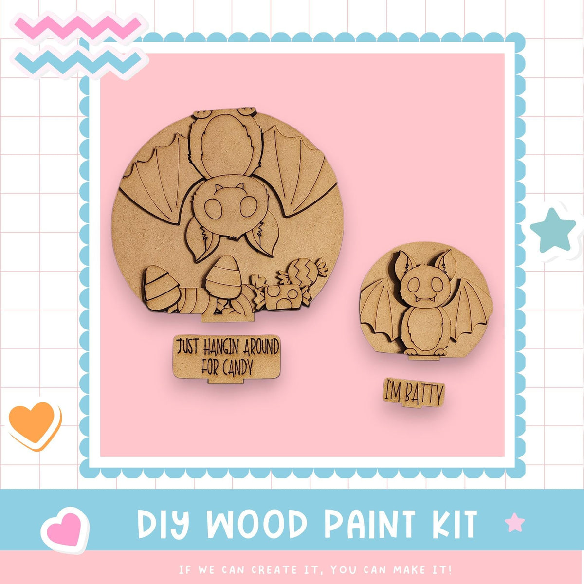 The image is a DIY wood paint kit featuring two wooden bats, one larger and one smaller, with a sign that says "Just hung around for candy" and "I'm batting". The background is a pink color with a checkered pattern.