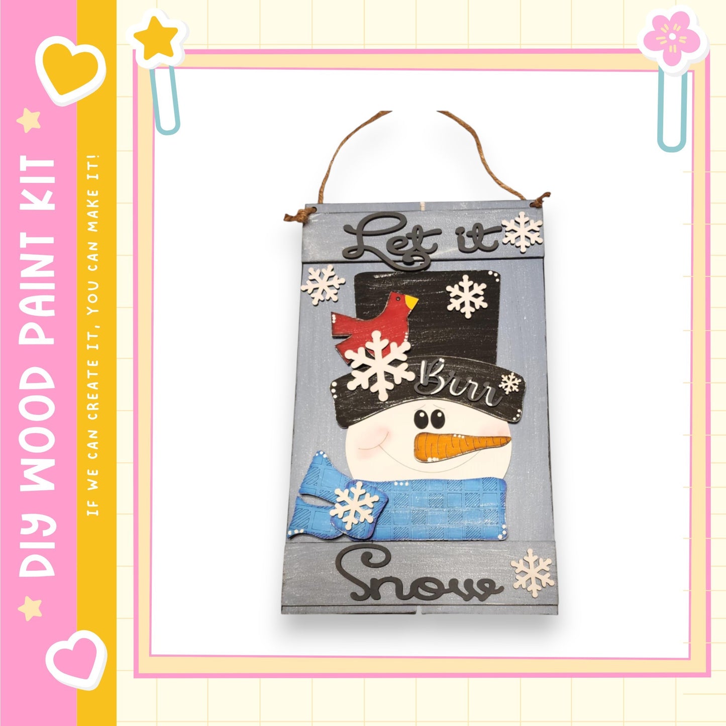A wooden sign with a snowman and the text "Let it burn snow" is displayed against a pink and yellow background.