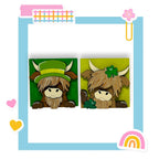 a card with a picture of a cow wearing a green hat