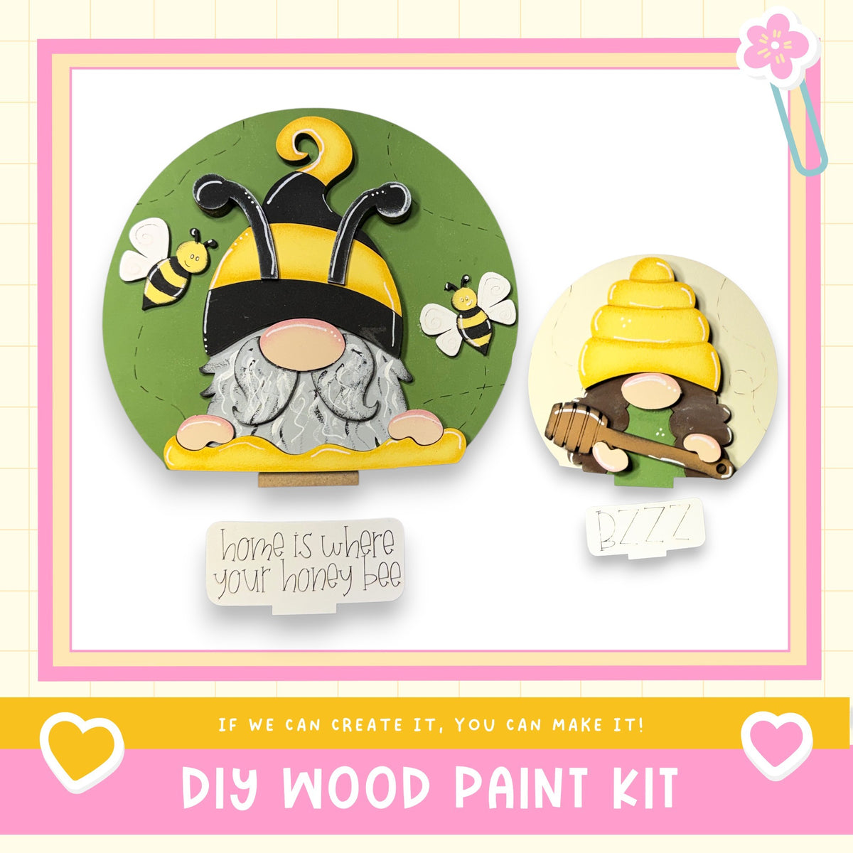 two wooden gnome figurines, one larger and one smaller, with bee and honeycomb decorations. The larger gnome is wearing a yellow hat and holding a honeycomb, while the smaller gnome is holding a wooden spoon. The image also includes a note that says "Home is where your honey bee" and a DIY wood paint kit, suggesting that the gnomes can be created using the provided kit.
