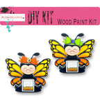 a pair of pin badges with a cartoon character on them