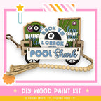 a wooden craft kit with a sign and a wheelbarrow