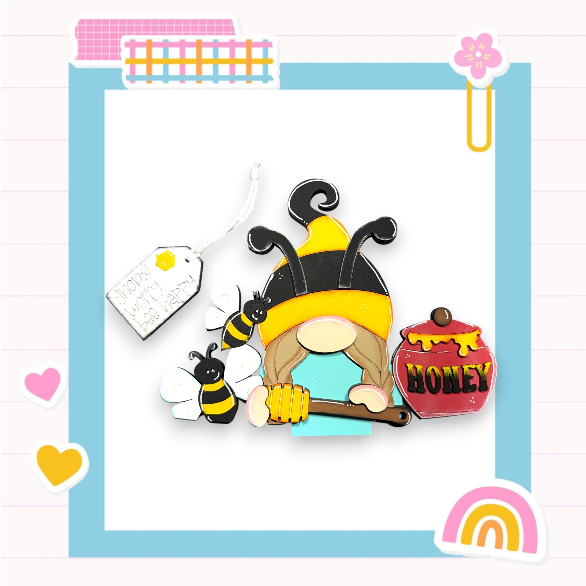 A whimsical illustration of a gnome figure wearing a bee costume, holding a honey pot, surrounded by various decorative elements such as a tag, hearts, and a rainbow.