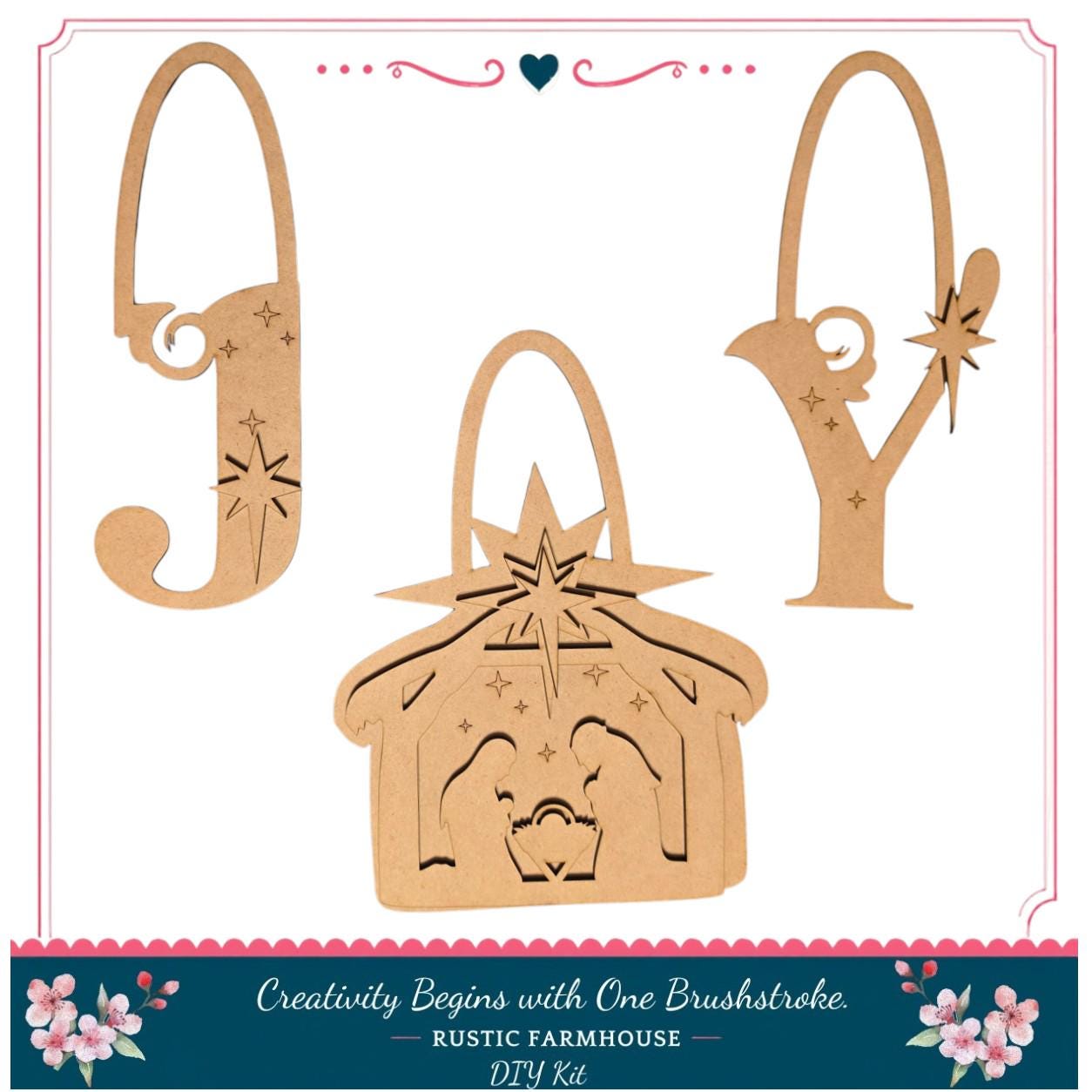 three wooden ornaments, each with a unique design, arranged in a row. The ornaments are labeled as "Joy", "Y", and "V", and they appear to be part of a DIY kit for creating these decorative pieces.