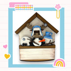 a picture of a cow in a bird house
