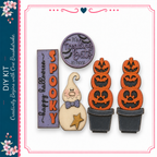 Halloween-themed decorations, including a spooky ghost, a witch, and two carved pumpkins.