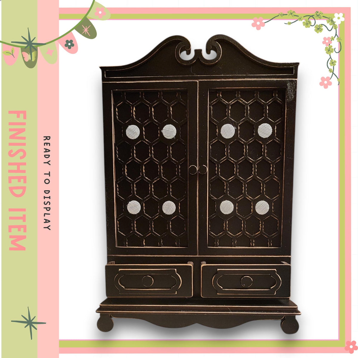 a dark wooden cabinet with two doors and two drawers, set against a pink and green floral border.