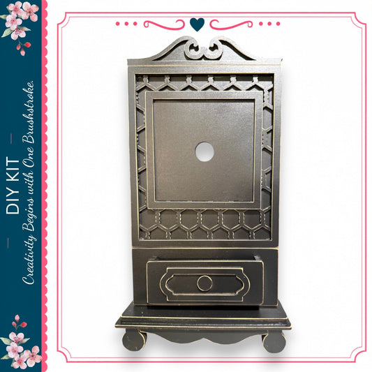 a black wooden cabinet with a decorative design on the front.
