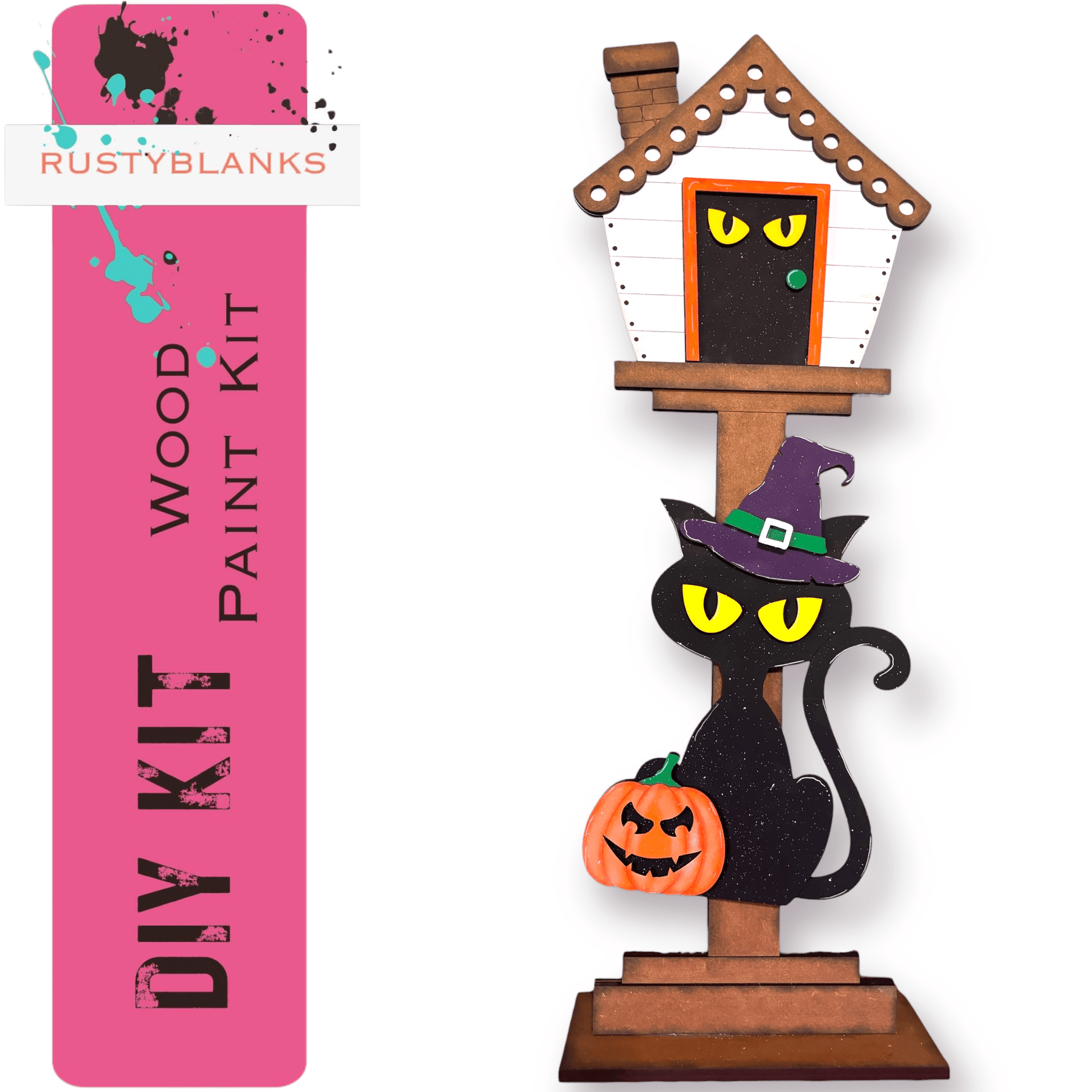 a wooden halloween decoration with a cat and a house