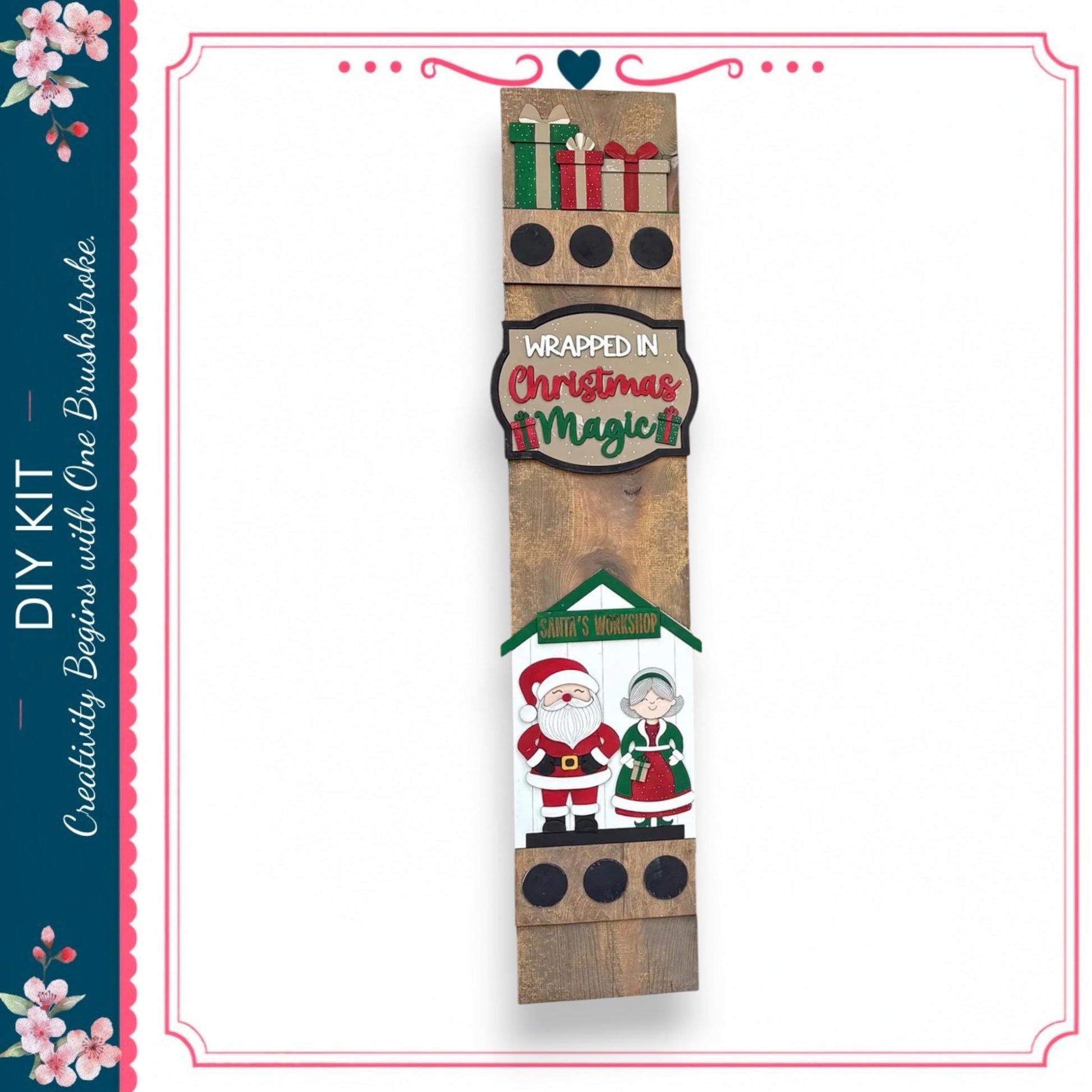a wooden sign with various Christmas-themed decorations, including a Santa Claus and an elderly couple, as well as a sign that says "wrapped in Christmas magic".