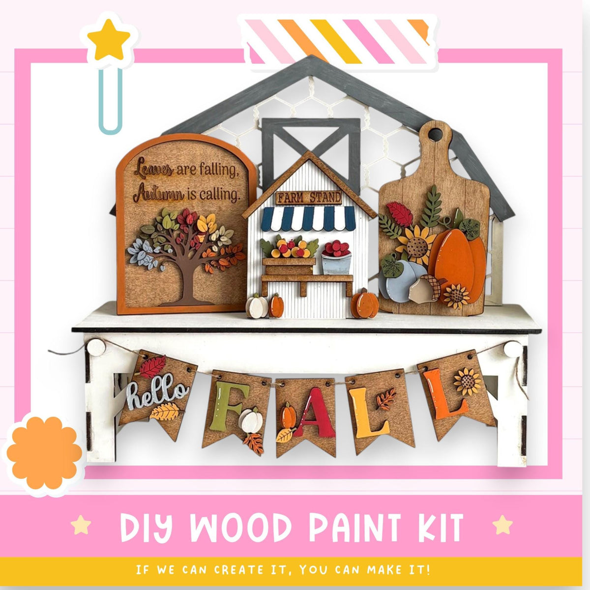 The image is a colorful and festive DIY wood paint kit for creating a fall-themed display. It includes a wooden house, a sign, and a banner that says "Hello Fall". The kit appears to be made of wood and is designed to be assembled and painted to create a seasonal decoration.