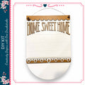 a wooden sign with the text "HOME SWEET HOME" written on it. The sign is hanging on a wall and appears to be a DIY kit.