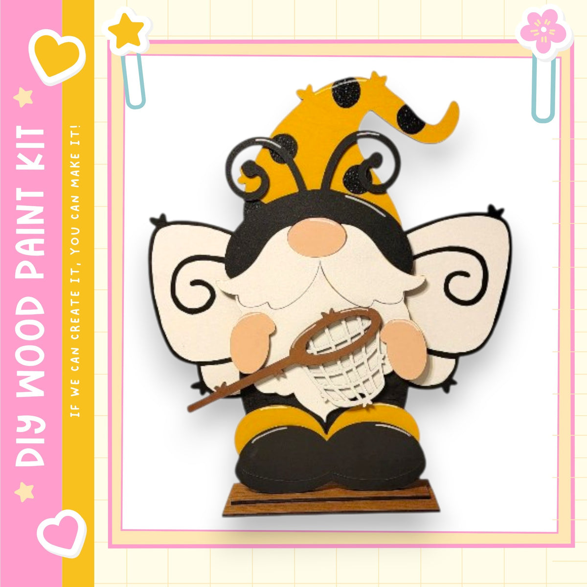 A whimsical wooden gnome figure with a bee-like appearance, holding a net and wearing a hat with a yellow and black pattern.