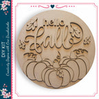 a wooden sign with the word "Hello" carved into it, surrounded by decorative leaves and pumpkins.