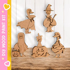 A collection of wooden cutouts depicting various Halloween-themed characters, including a witch, pumpkin, ghost, and duck.