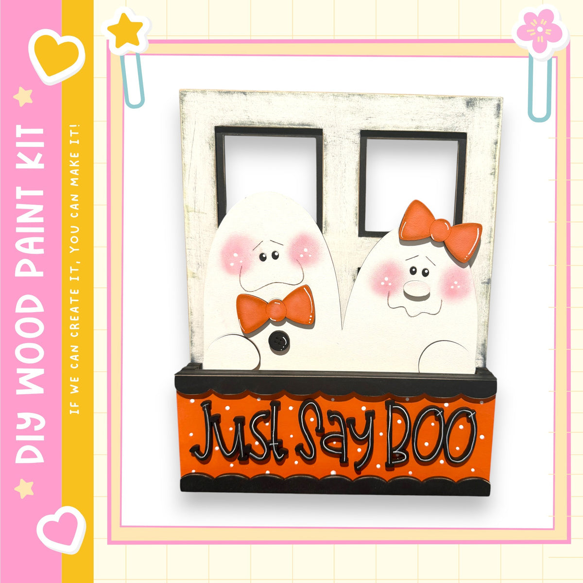 A wooden frame with two ghostly figures wearing orange bows, and the text "Just Say Boo" on the front.