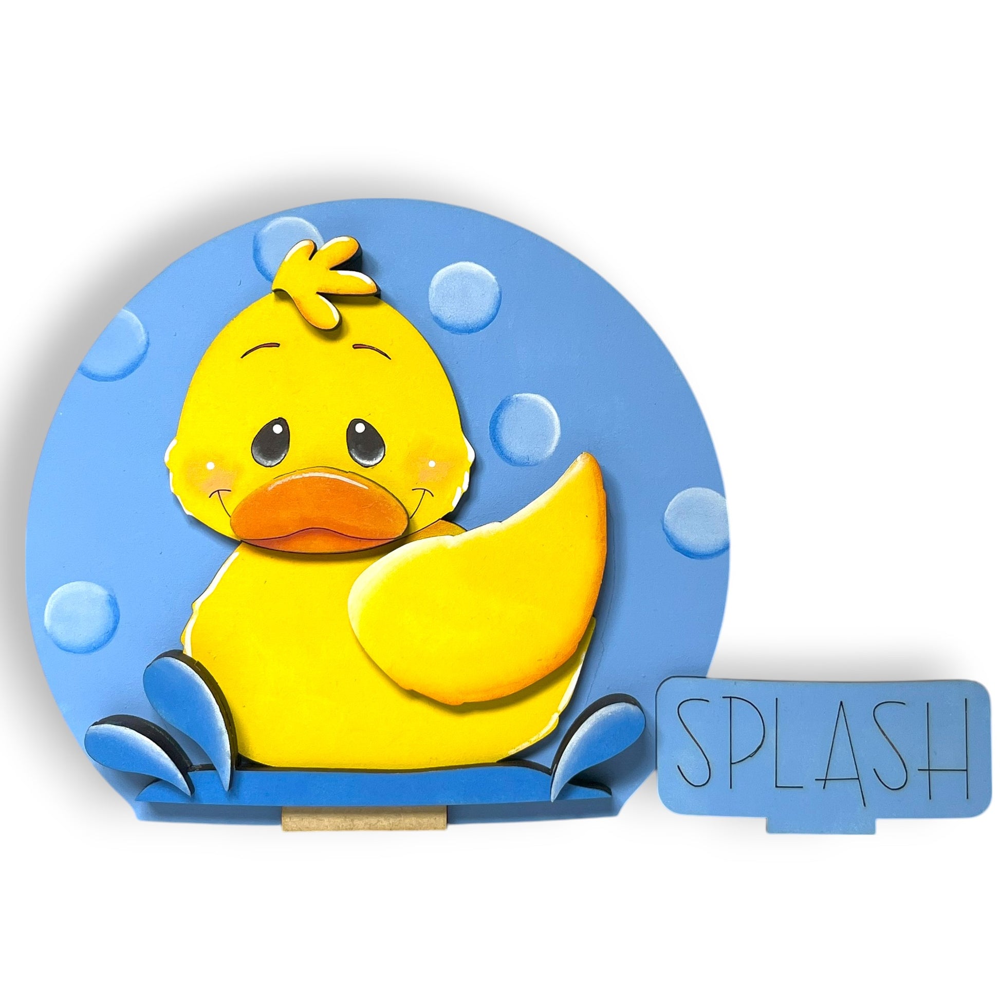 A yellow duck with a smiling expression is sitting on a blue background with bubbles, accompanied by the word "SPLASH" in the bottom right corner.