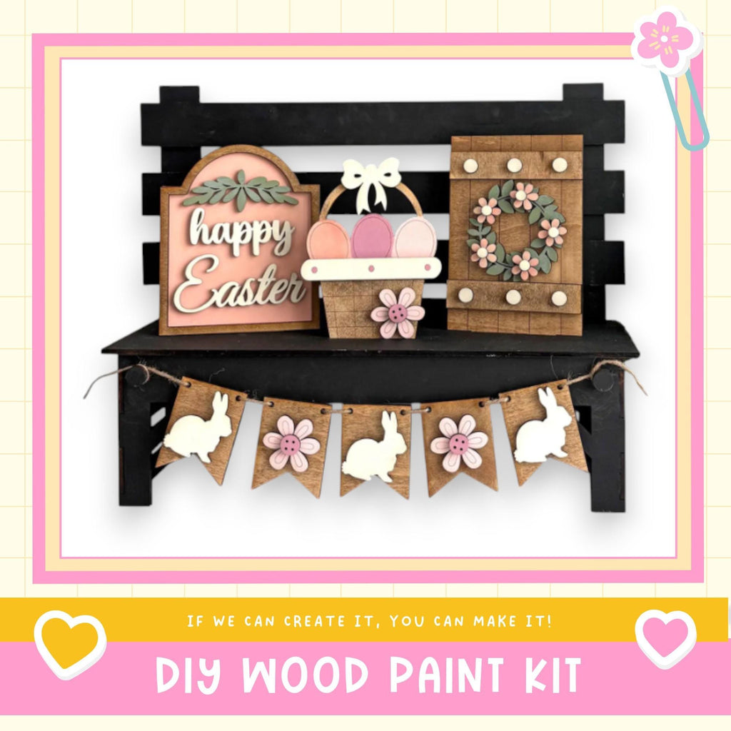 A DIY wood paint kit for creating Easter decorations, including a sign, a wreath, and a banner with wooden rabbits.