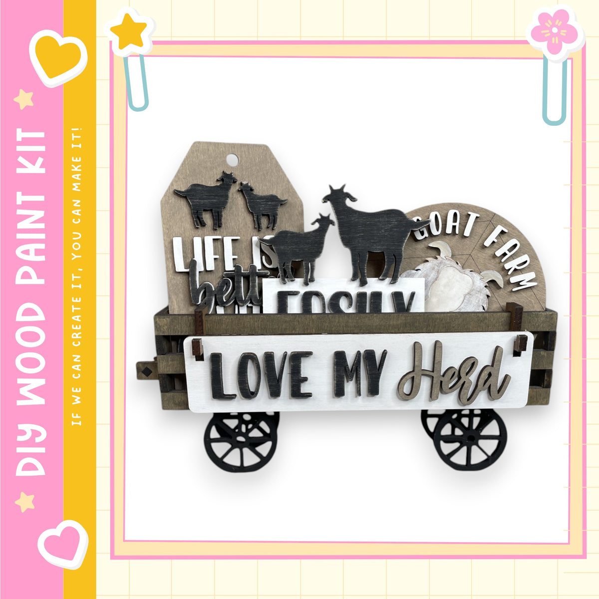 a wooden wagon with a sign that says "Love My Herd" and a small black goat figure on it.