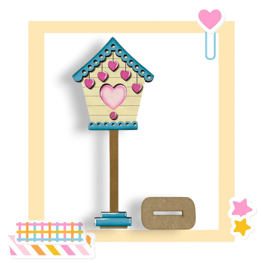 a picture of a birdhouse with a heart on it