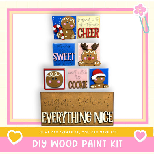 The image is a colorful and festive DIY wood paint kit featuring various cookie cutouts and a sign that says "sugar, spice & everything nice".