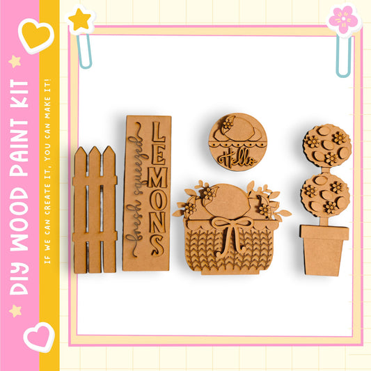 various wooden shapes, including a wooden fence, a wooden basket, and a wooden plant, arranged in a row.
