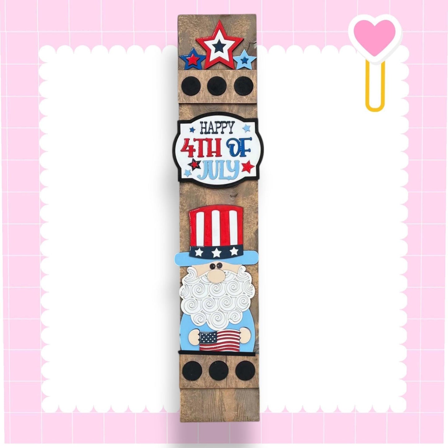 a wooden ruler with a happy fourth of july design on it