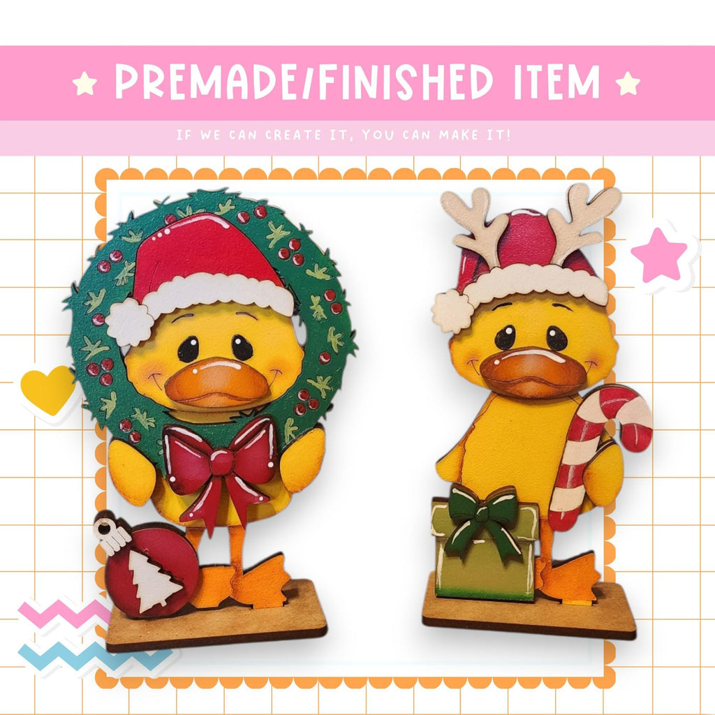 a couple of ducks wearing christmas hats and scarves