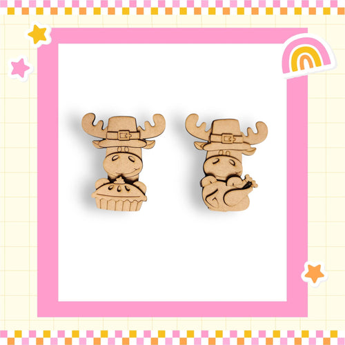 two wooden cartoon animal figures wearing festive hats, set against a pink and yellow checkered background with a rainbow and stars.