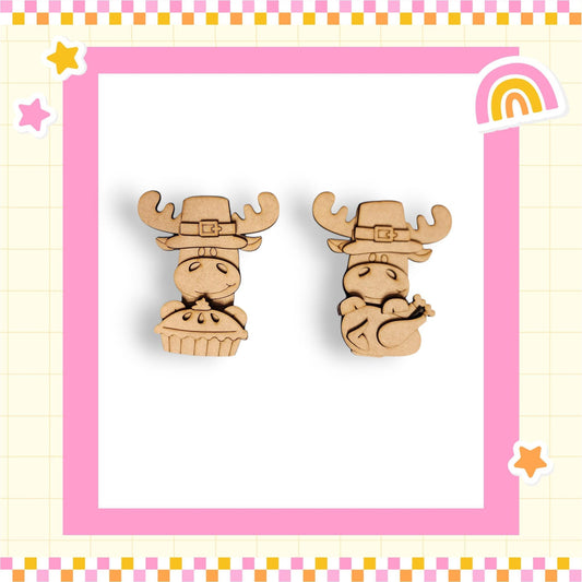 two wooden cartoon animal figures wearing festive hats, set against a pink and yellow checkered background with a rainbow and stars.
