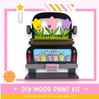 A colorful wooden truck with a floral design on the back, featuring a sign that says "Hello Spring" and the words "Flower Market" below it.