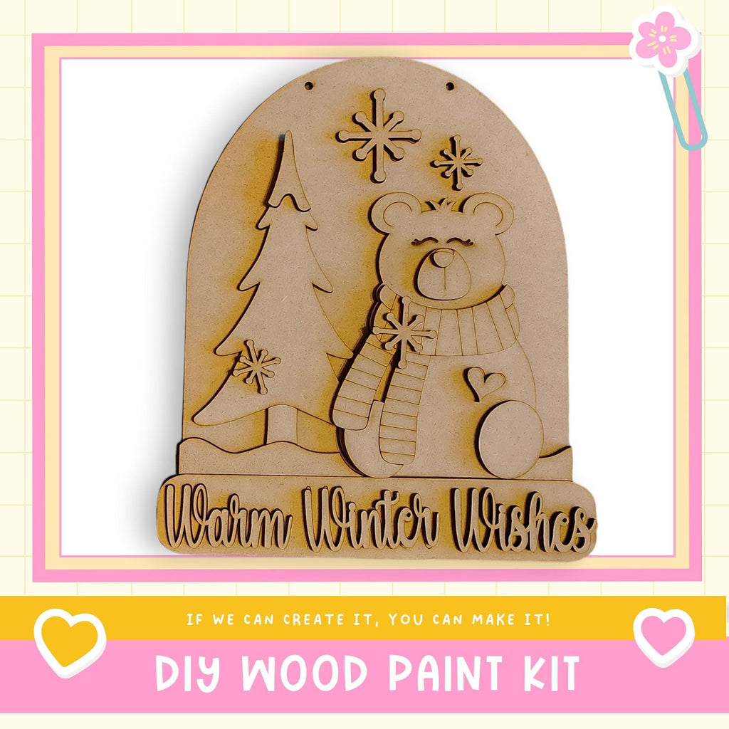 a DIY wood paint kit for creating a wooden snow globe with a bear and snowflakes.