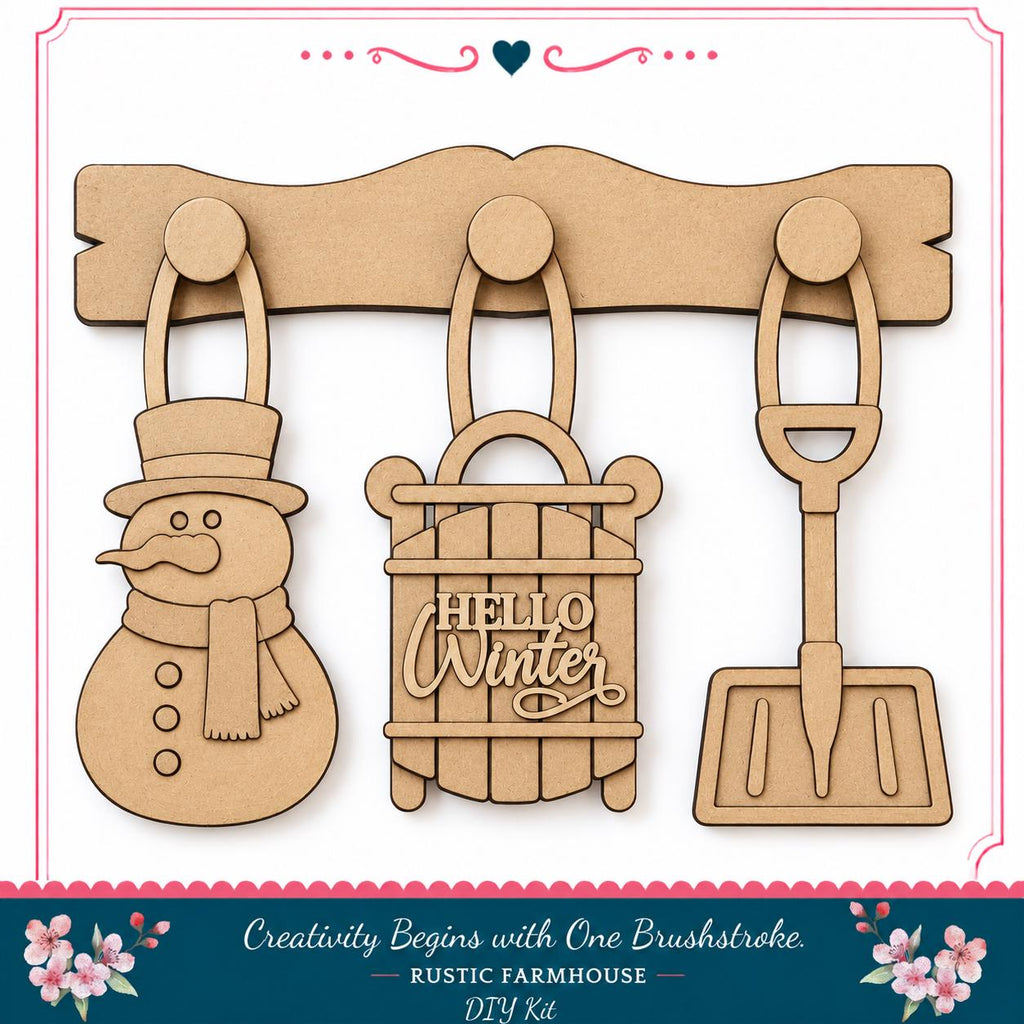 a DIY kit for creating winter-themed ornaments, including a snowman, a sled, and a shovel.